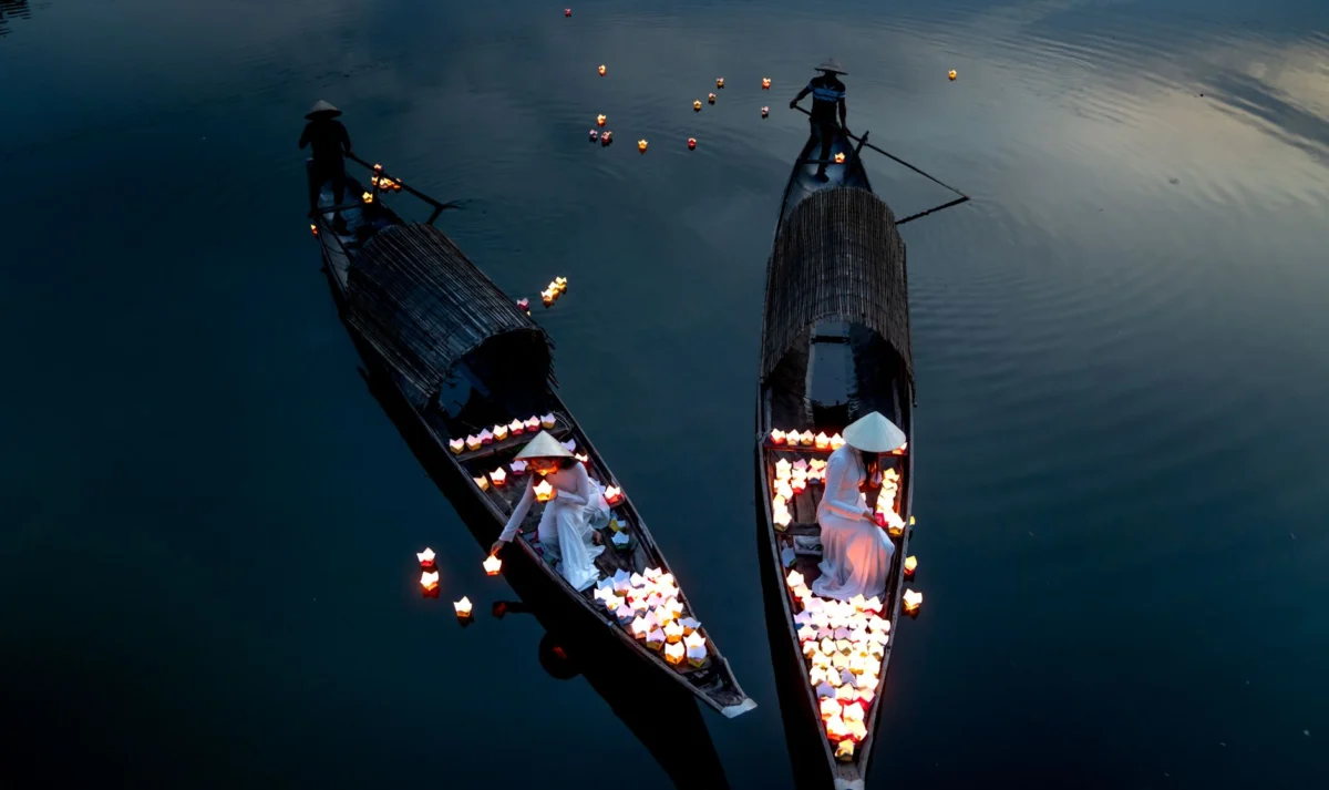Lantern boats on the river in Hoi An at sunset