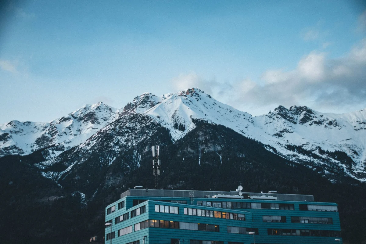 Scenic Innsbruck skyline at night with city lights and mountains