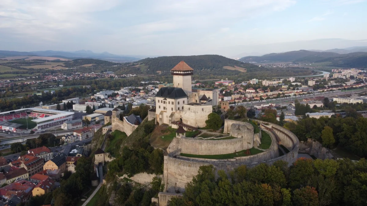 A romantic view of Jajce's iconic fortress at sunset