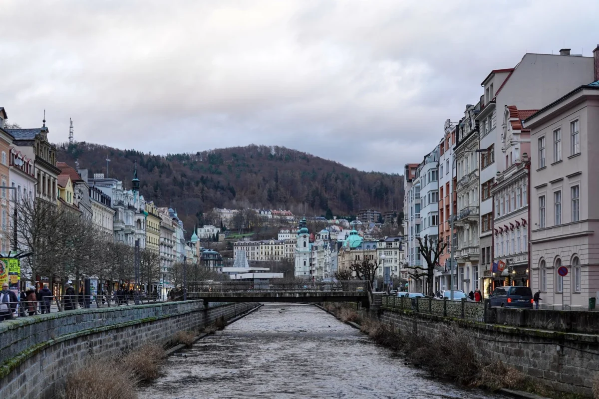 Romantic evening view of Karlovy Vary riverside skyline