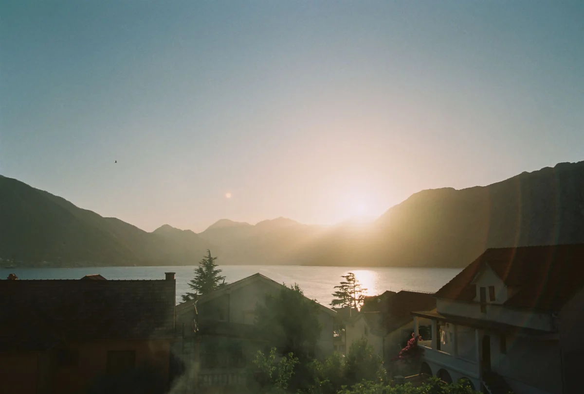 A breathtaking sunset over the bay in Kotor, highlighting the romance of the city.
