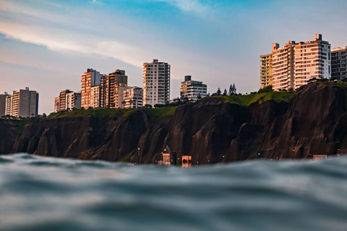 Panoramic view of Lima skyline at dusk highlighting cultural landmarks