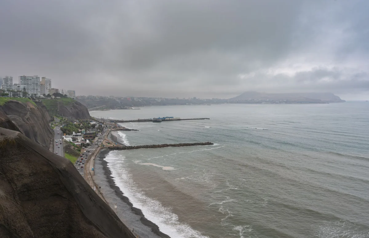 Scenic view of Lima's coast highlighting city skyline and colorful art