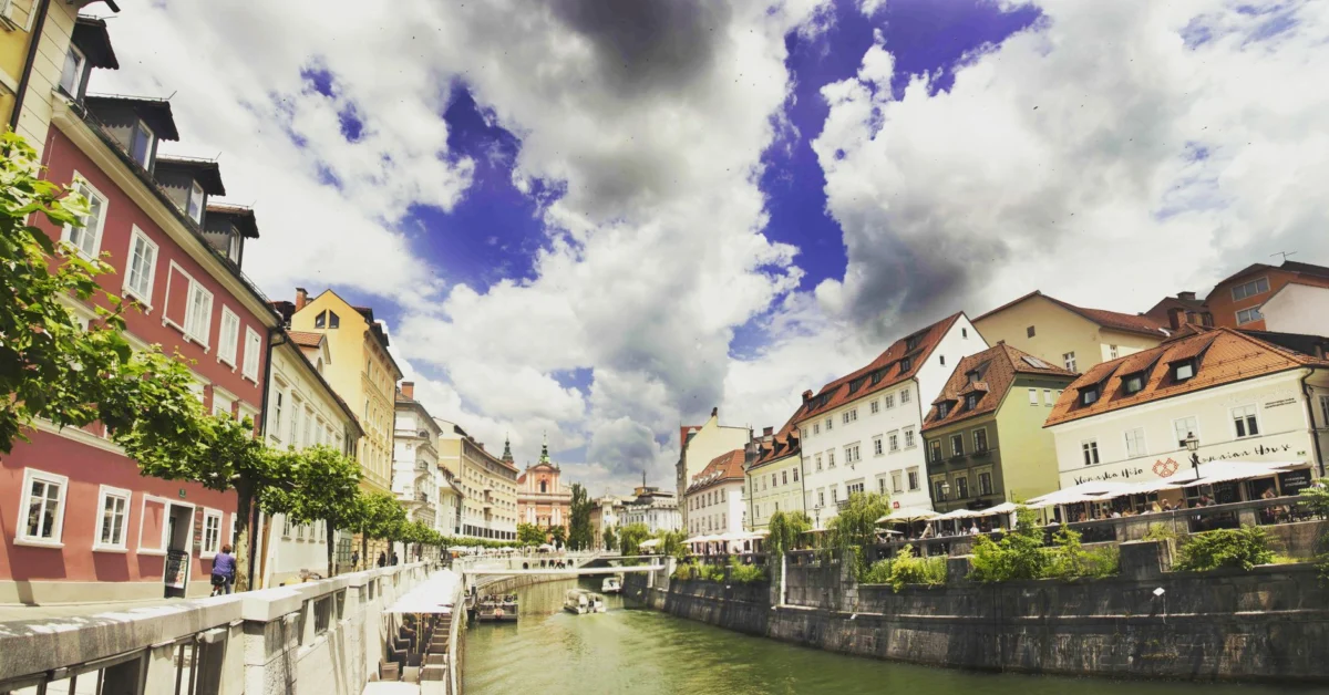 Romantic riverside view of Ljubljana with iconic landmarks