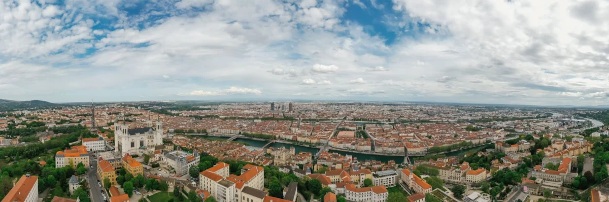 A panoramic view of the Lyon skyline at sunset