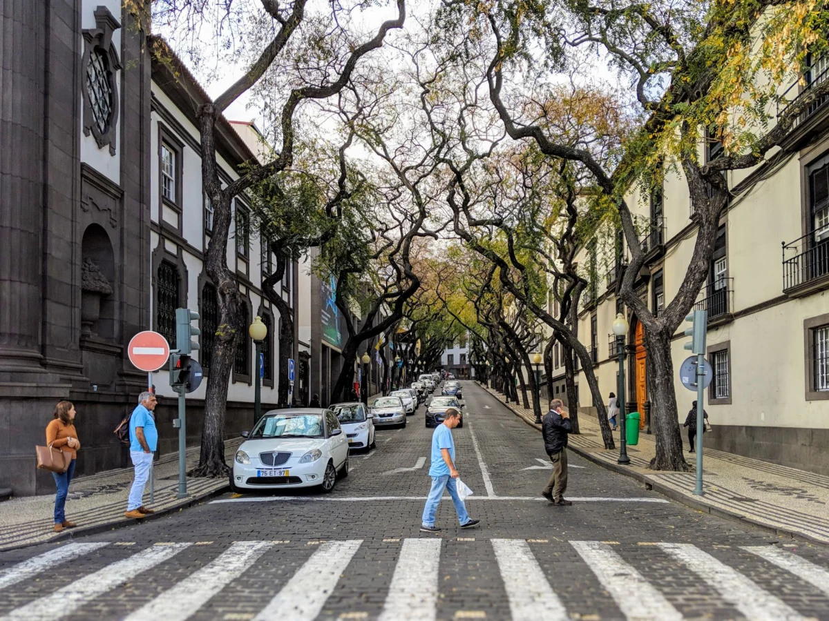 Romantic couples walking along historic streets in Madeira