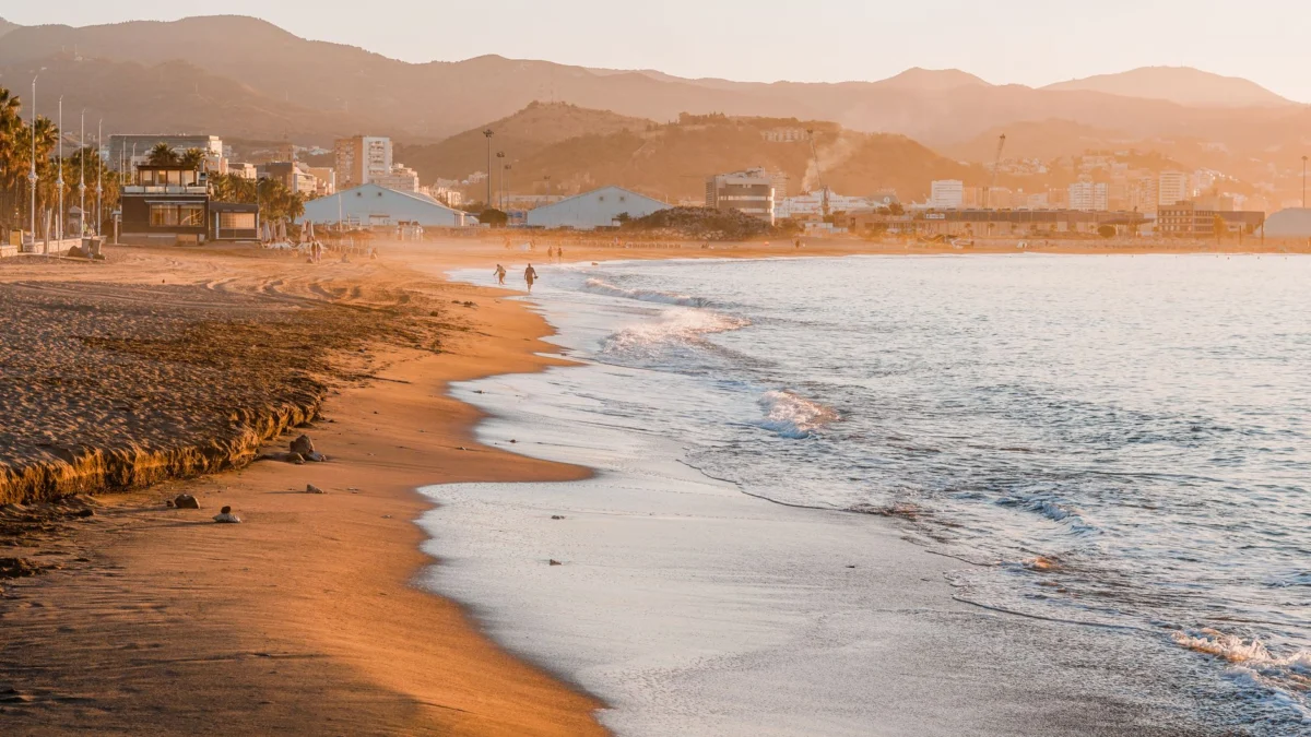 Malaga beach view with lively nightlife scene