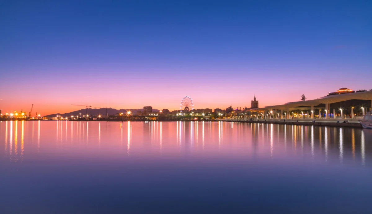 Romantic couple enjoying Malaga waterfront view