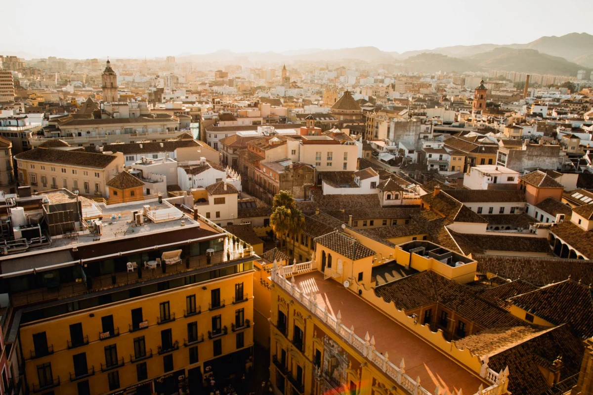 Rooftop view of a sunset over Malaga's skyline