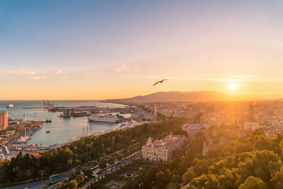 Sunset view of Malaga skyline featuring iconic landmarks