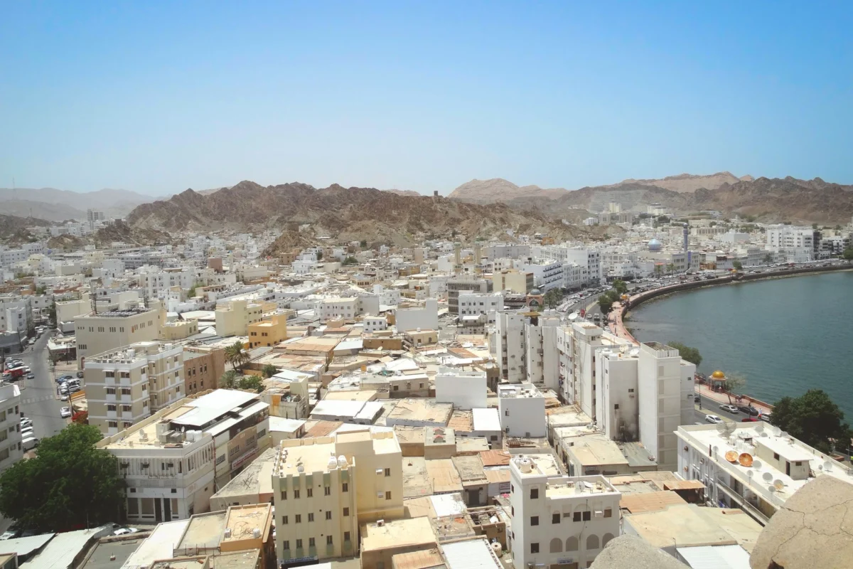 A breathtaking view of Muscat's harbor skyline at sunset