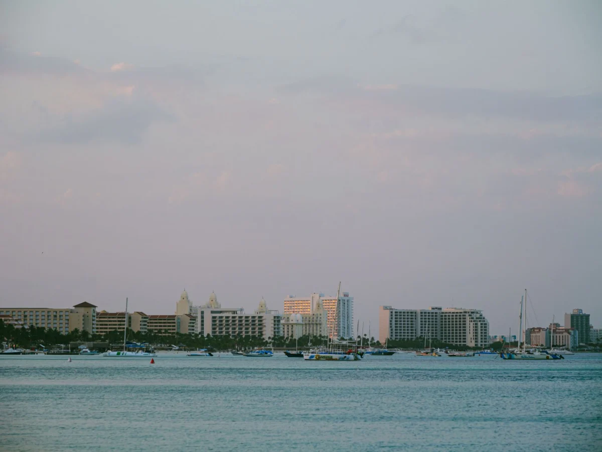 A breathtaking sunset over Oranjestad's waterfront skyline