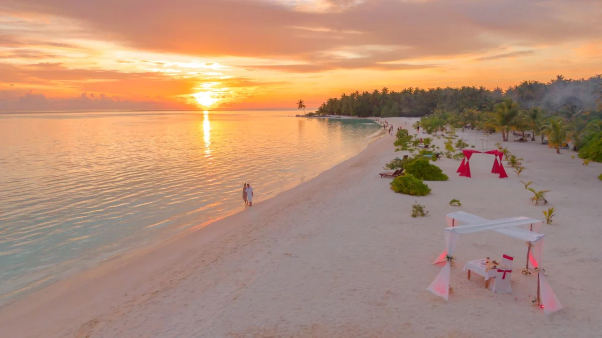 Romantic resort view over Dhigurah beaches at sunset