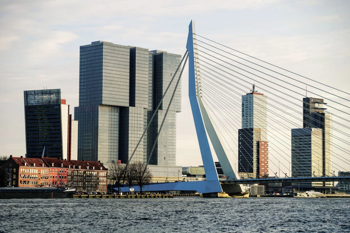 View of the Rotterdam skyline along the river at sunset