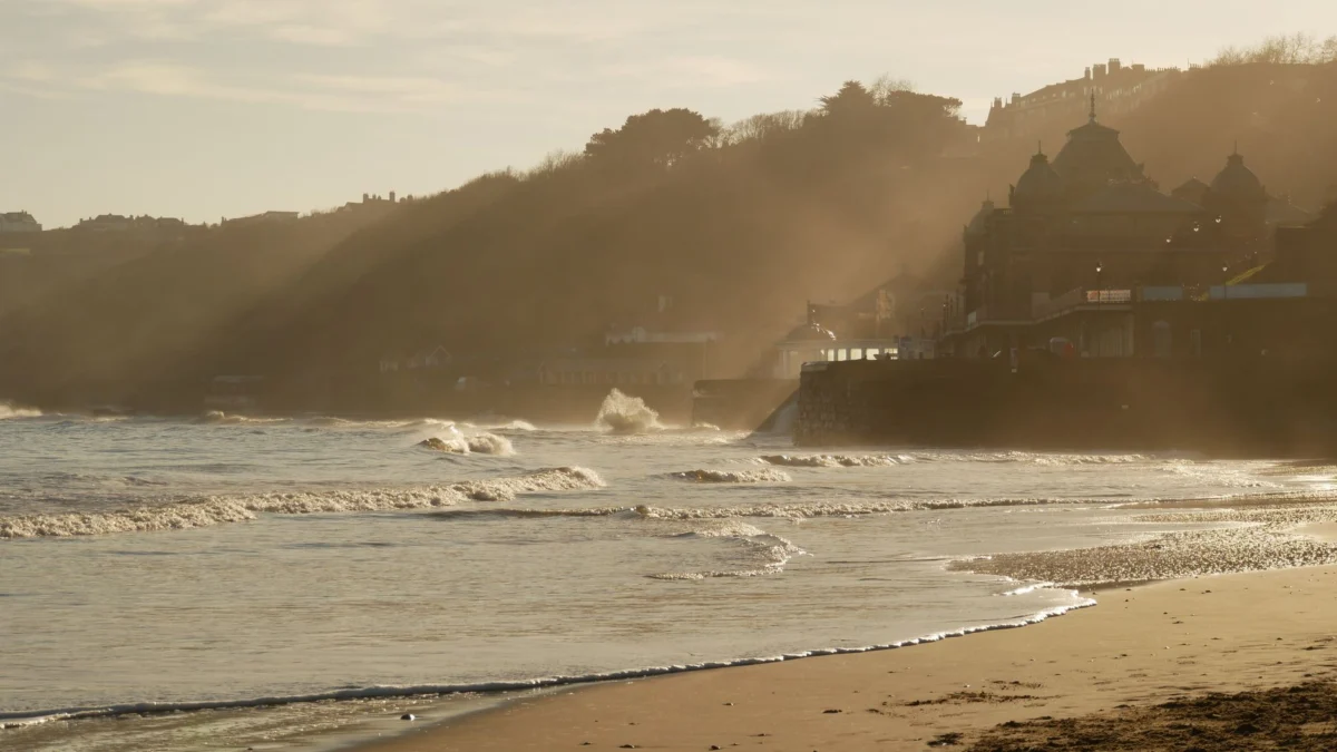 Romantic sunset view over Scarborough's coastline