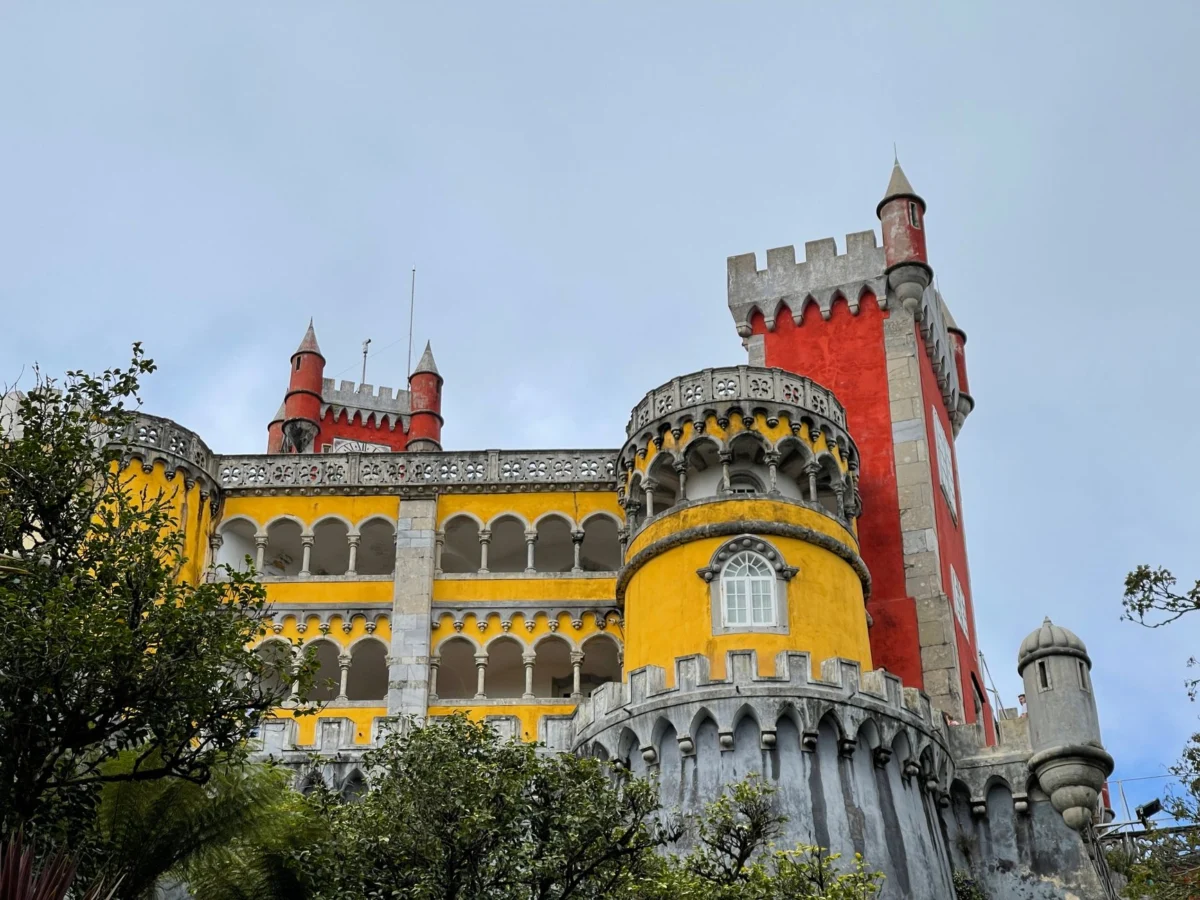 View of Sintra's vibrant palaces nestled in lush greenery