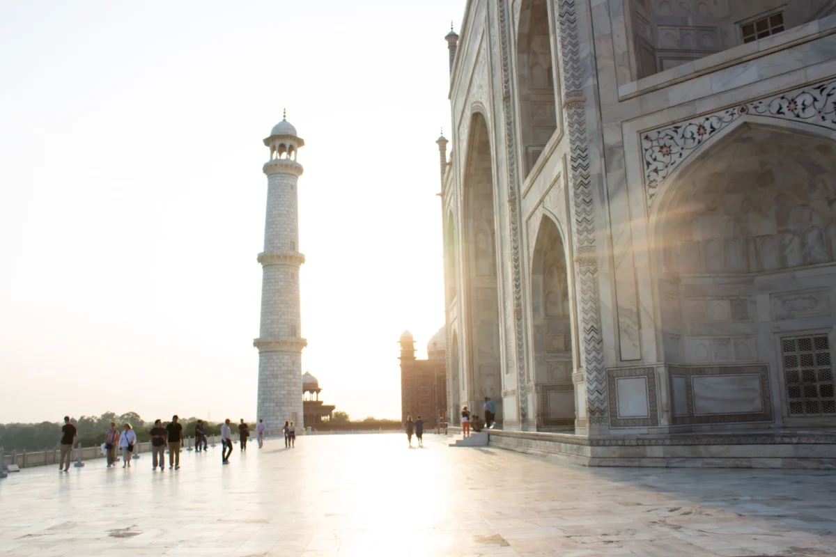 Taj Mahal silhouetted against sunrise sky in Agra