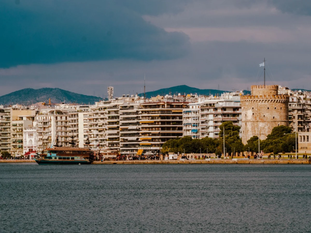 Sunset view of Thessaloniki's waterfront with city skyline