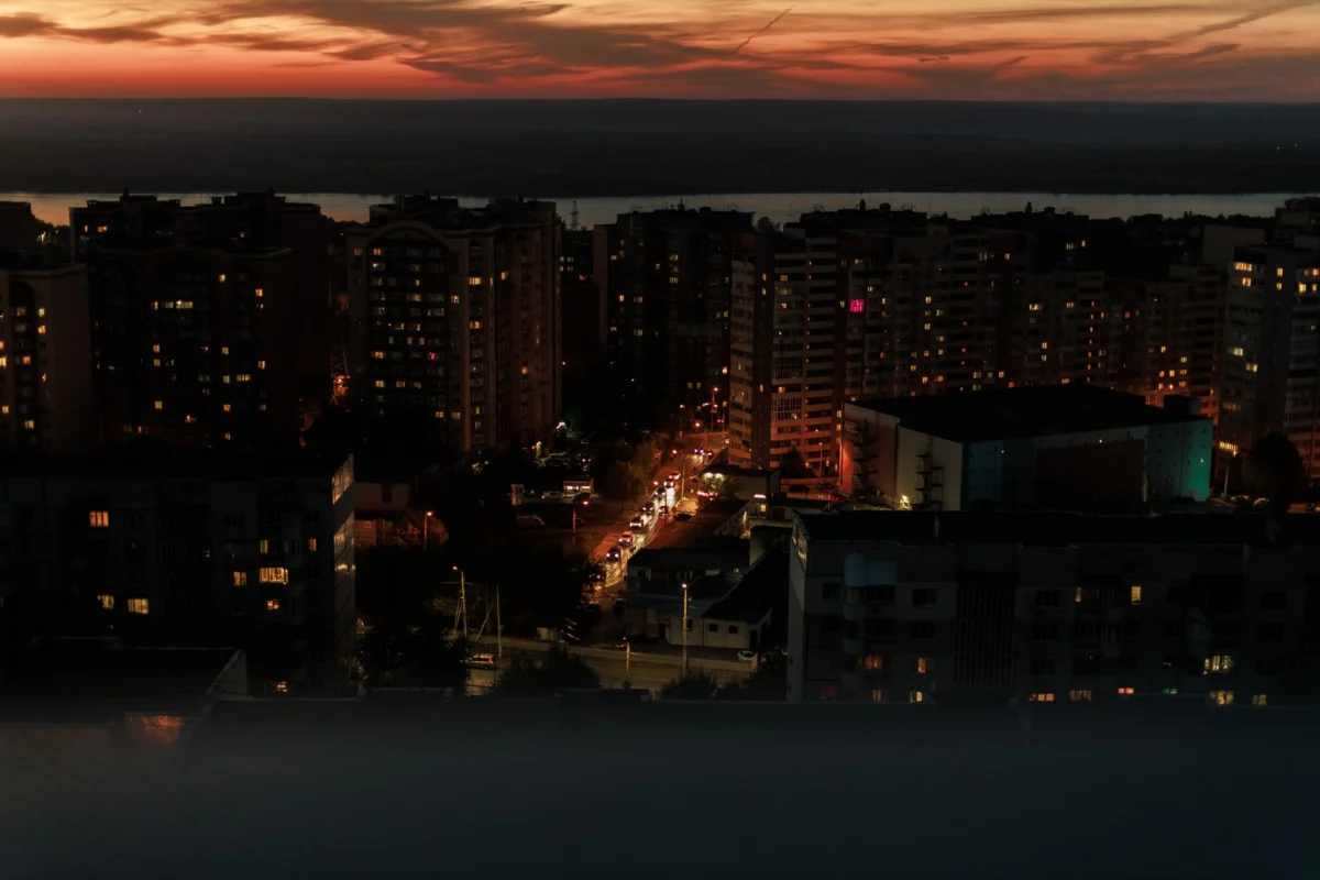 A romantic view of Tiraspol's city lights casting reflections on the Dniester River