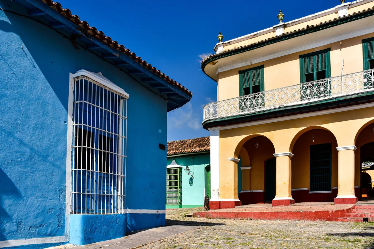 Vibrant colorful street in Trinidad, Cuba with cobblestones