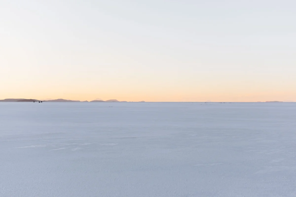 Panoramic view of Uyuni salt flats during sunset
