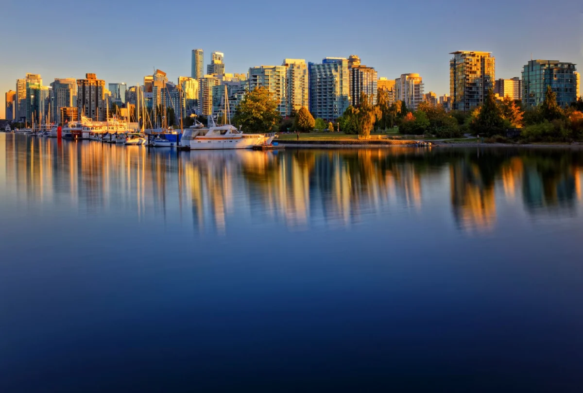 Vancouver skyline with colorful sunset reflecting on water