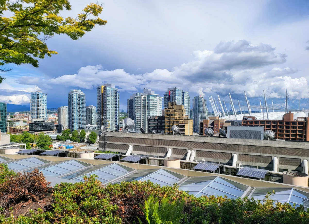 A stunning view of the Vancouver skyline highlighting the city's culinary neighborhoods