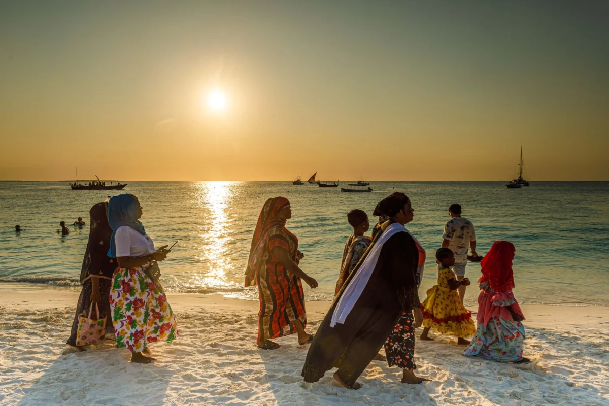 Stunning sunset over a Zanzibar beach with palm trees